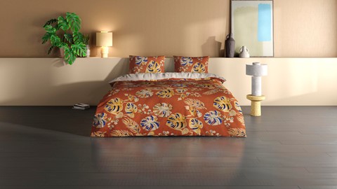 een bed met een bloemmotief erop