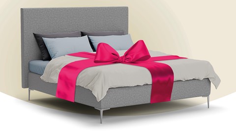 een bed met een roze strik