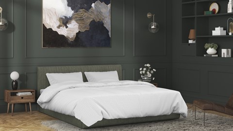 een bed met wit beddengoed en een schilderij aan de muur