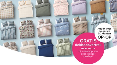 een groep bedden met verschillende gekleurde lakens