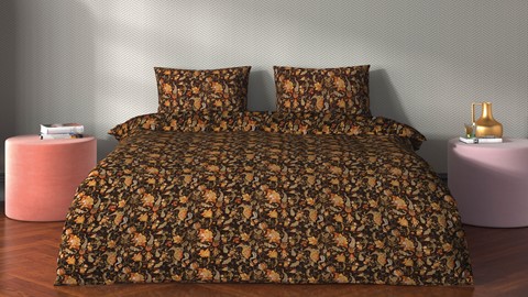 een bed met een bloemmotief