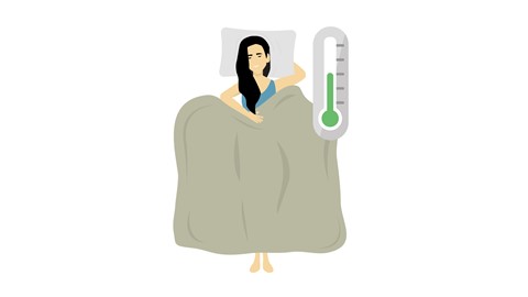 Een vrouw die in bed ligt met een thermometer
