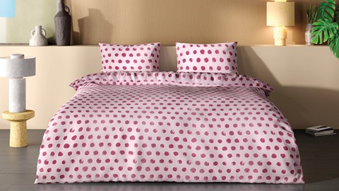 Een bed met roze stippen